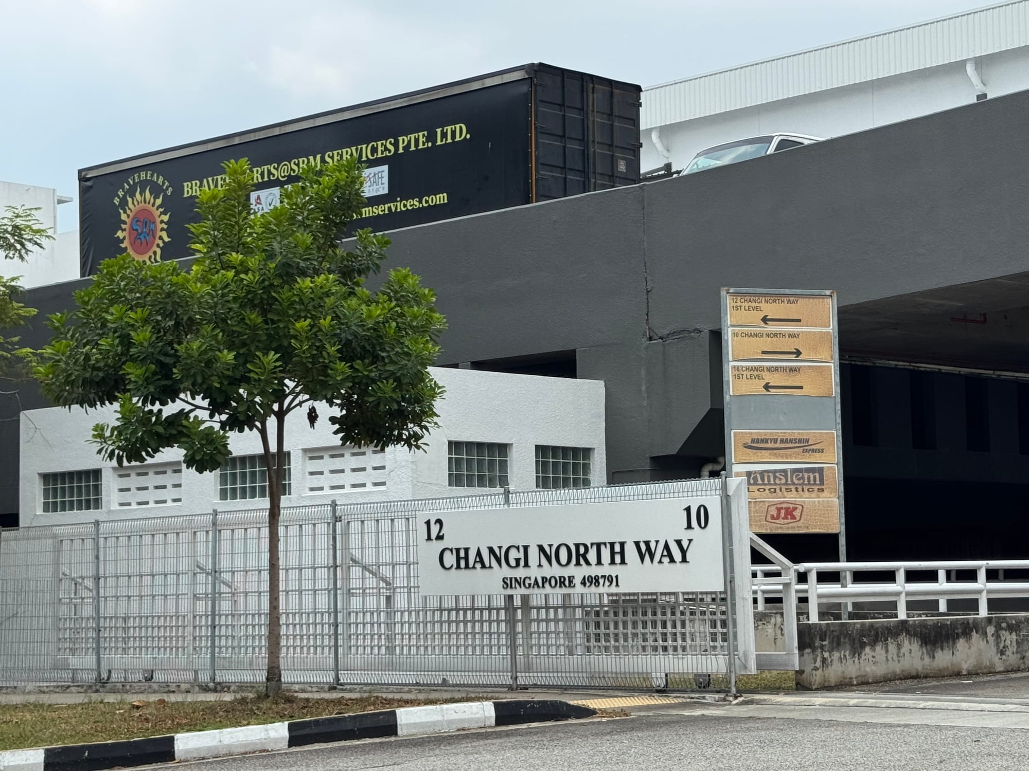 Entrance signage for 12 Changi North Way, Singapore 498791, with tenant directory board