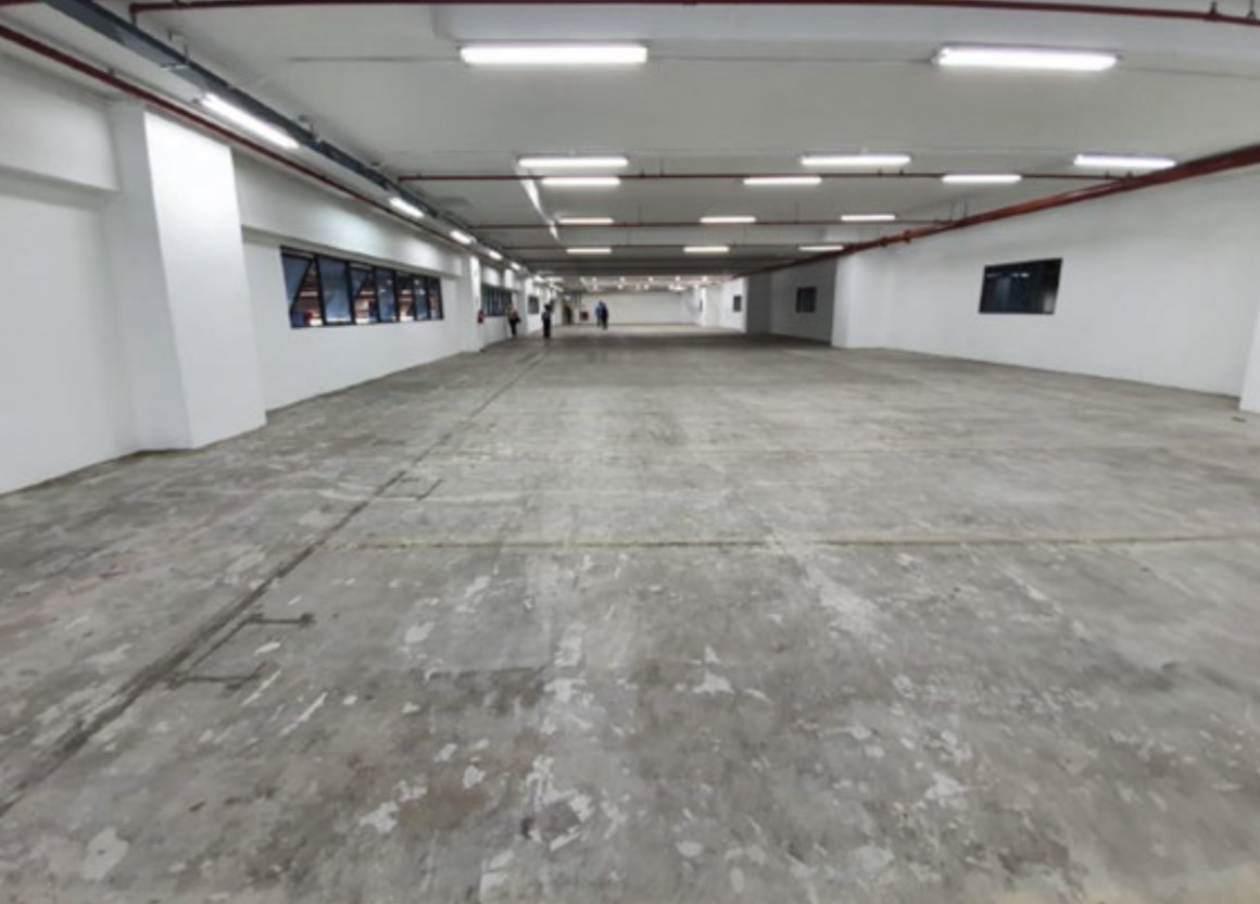 Warehouse corridor and circulation space with concrete flooring